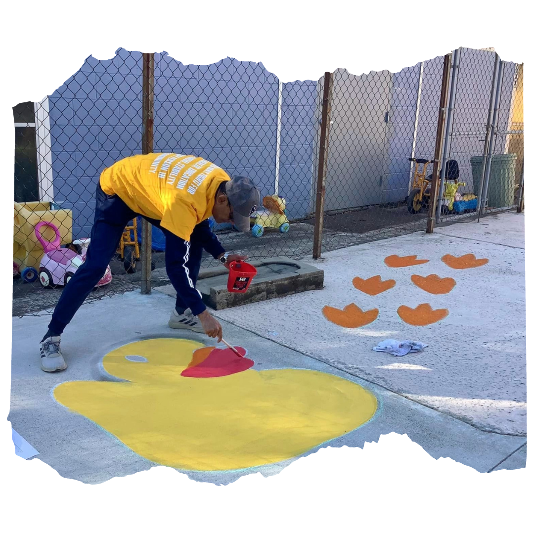 Volunteer painting on the trail